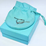 Tiffany 
Co. 0.17 Carat Princess Cut Diamond 
Platinum Ring 
Box Size 6