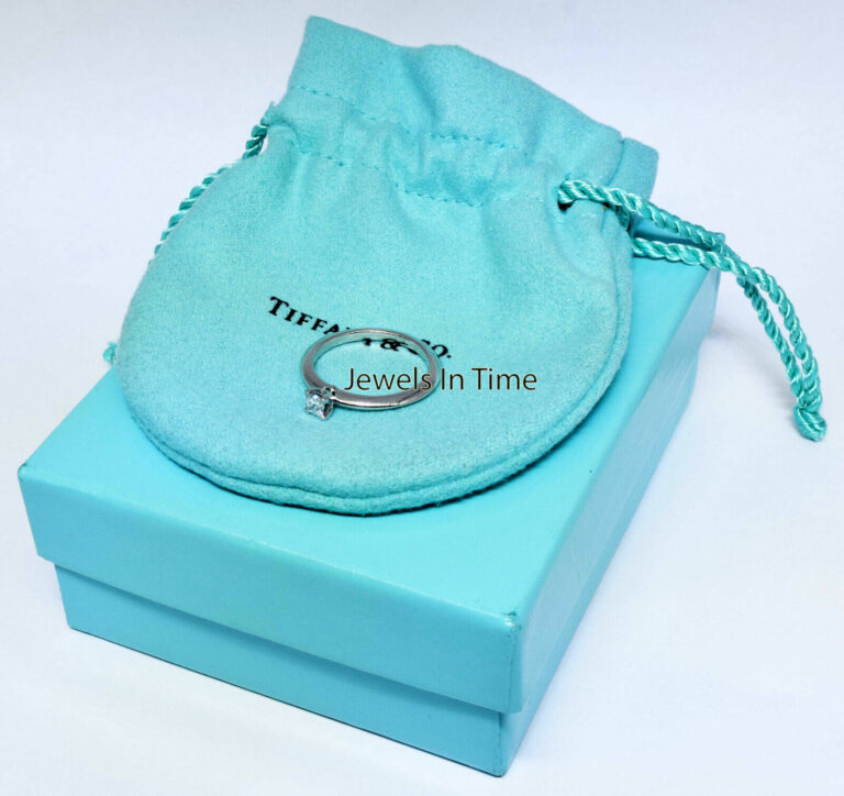 Tiffany 
Co. 0.17 Carat Princess Cut Diamond 
Platinum Ring 
Box Size 6